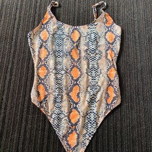 Orange snakeskin bodysuit